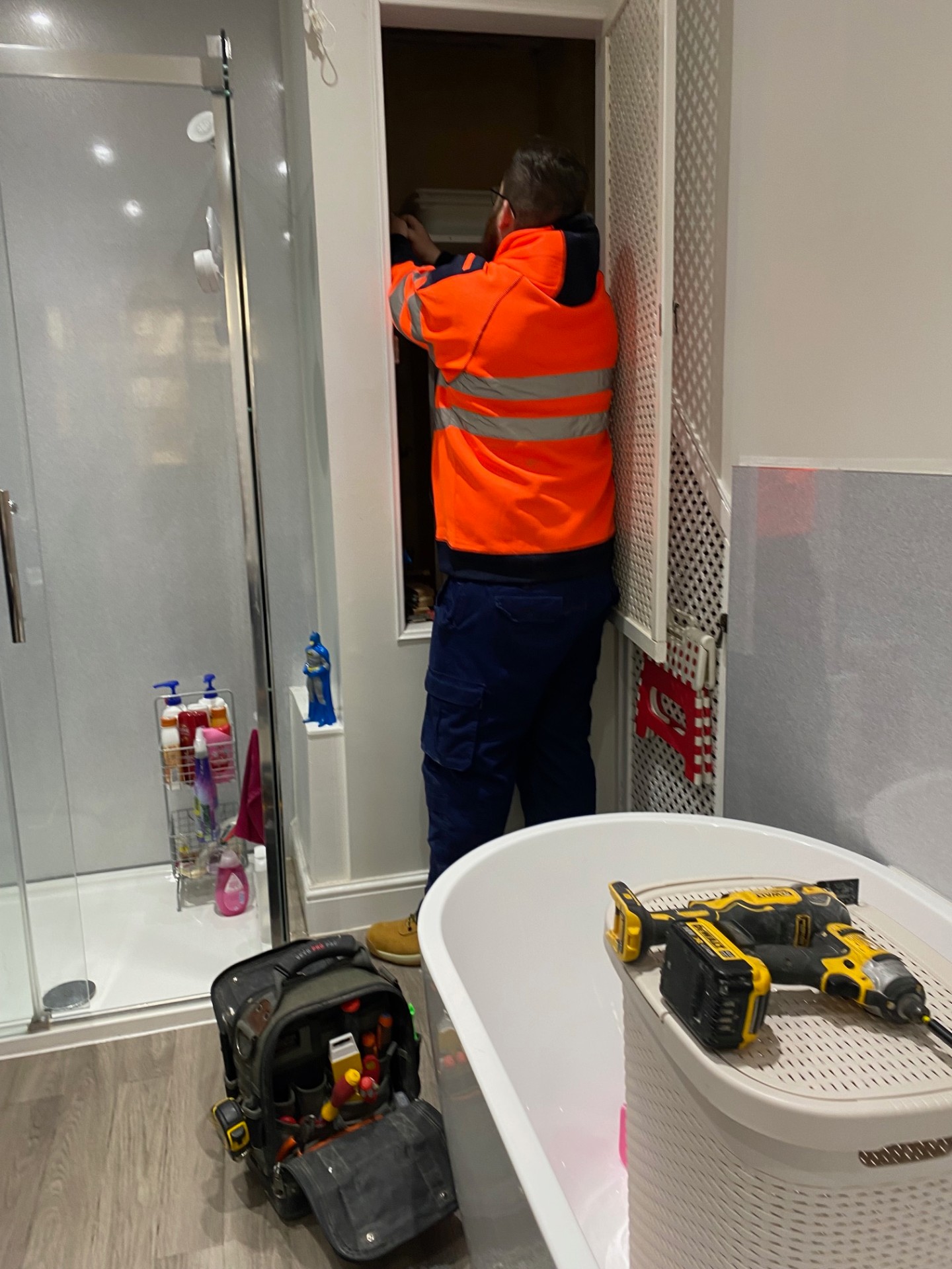 Professional bathroom electrical installation with zone-compliant wiring