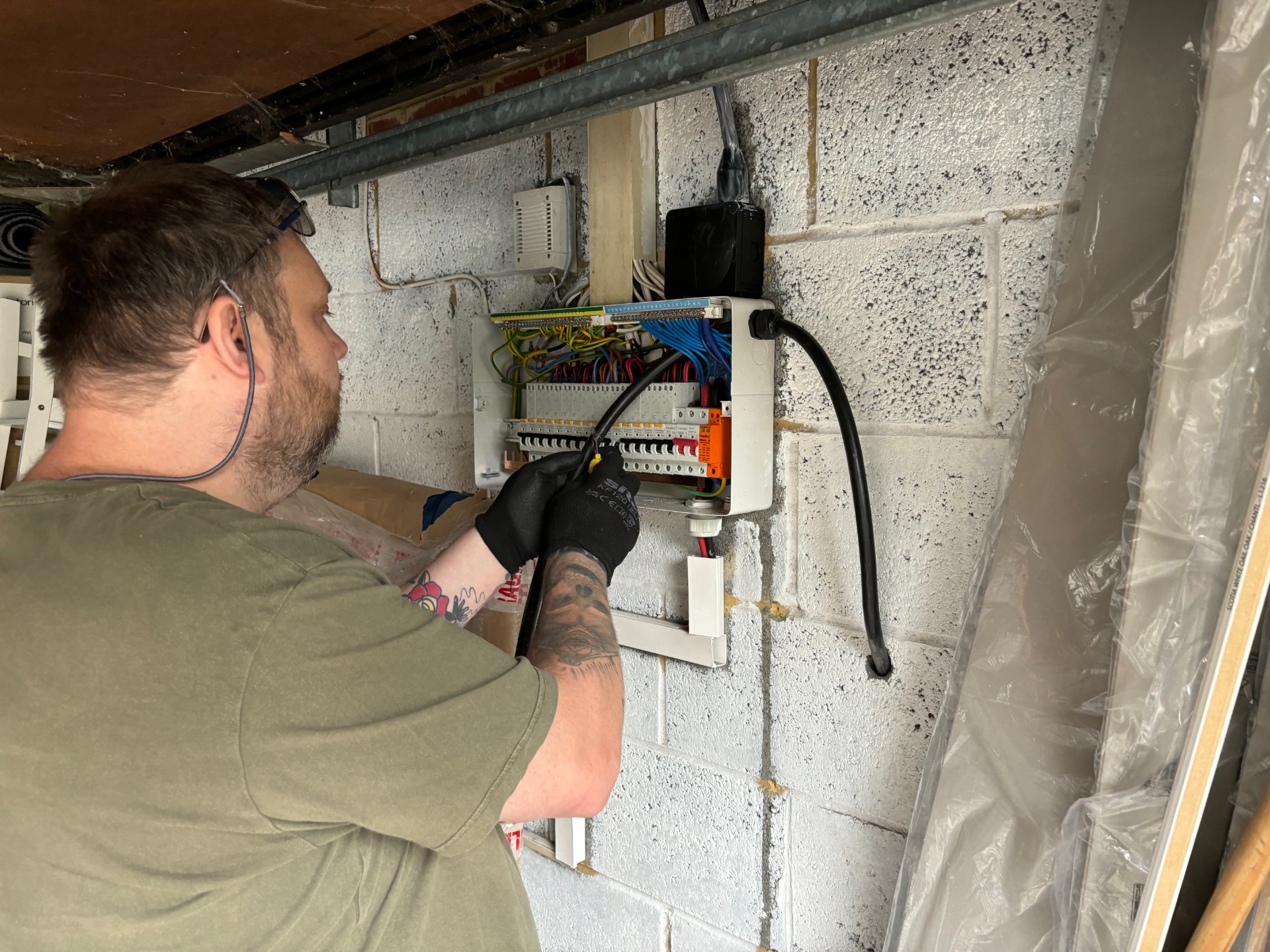 Engineer inspecting commercial distribution board