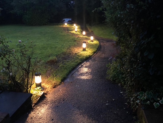 Garden lighting installation with outdoor LED fixtures