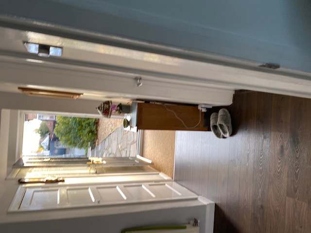 Hallway wall light installation in residential property