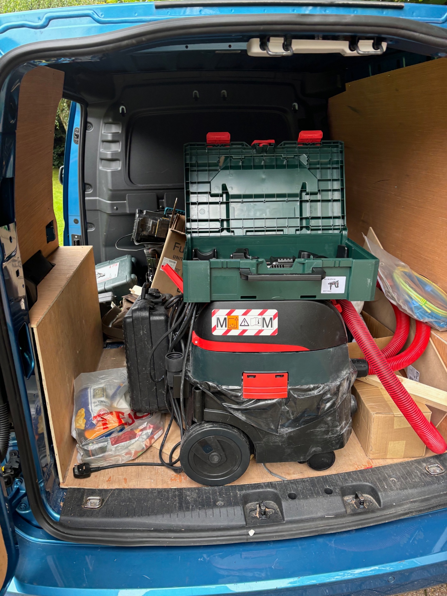 Rear of van showing professional tool setup